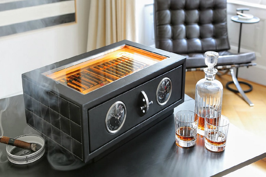 humidor with cigars and bottle of cognac