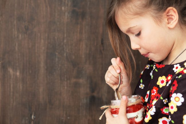 Best Yogurt Maker Review - girl enjoying yogurt